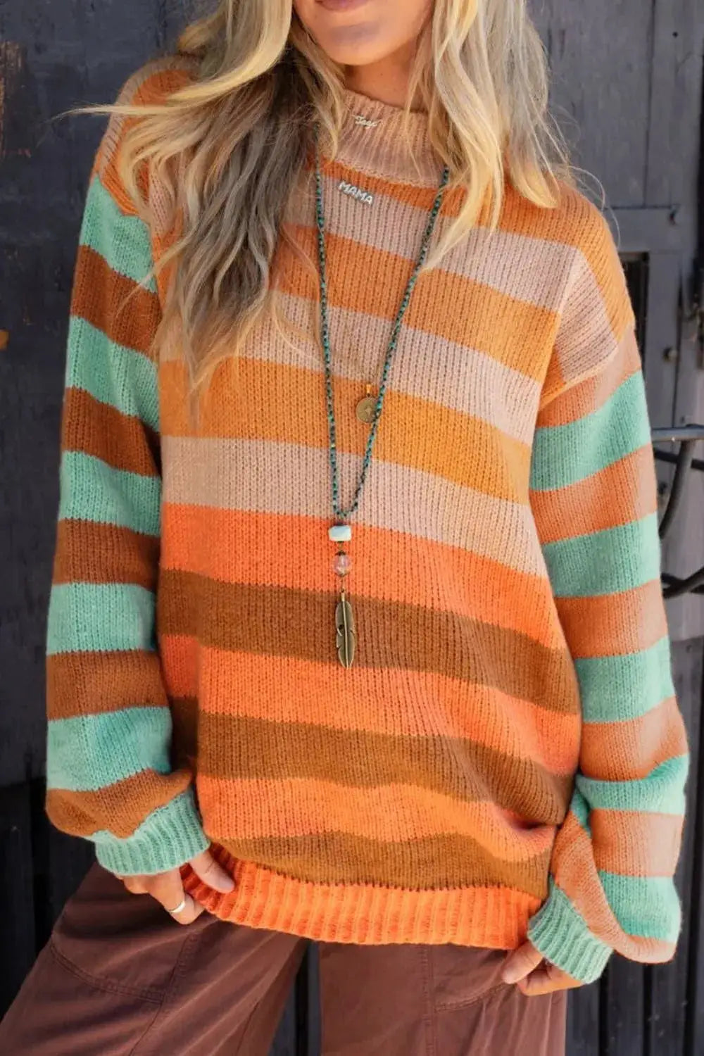 Belle Bijouix striped rainbow long-sleeve sweater in orange, peach, mint and beige.