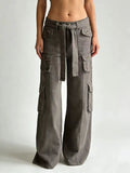 Wide Leg Cargo Jeans by Belle Bijouix in gray with a tied belt and cargo pockets.