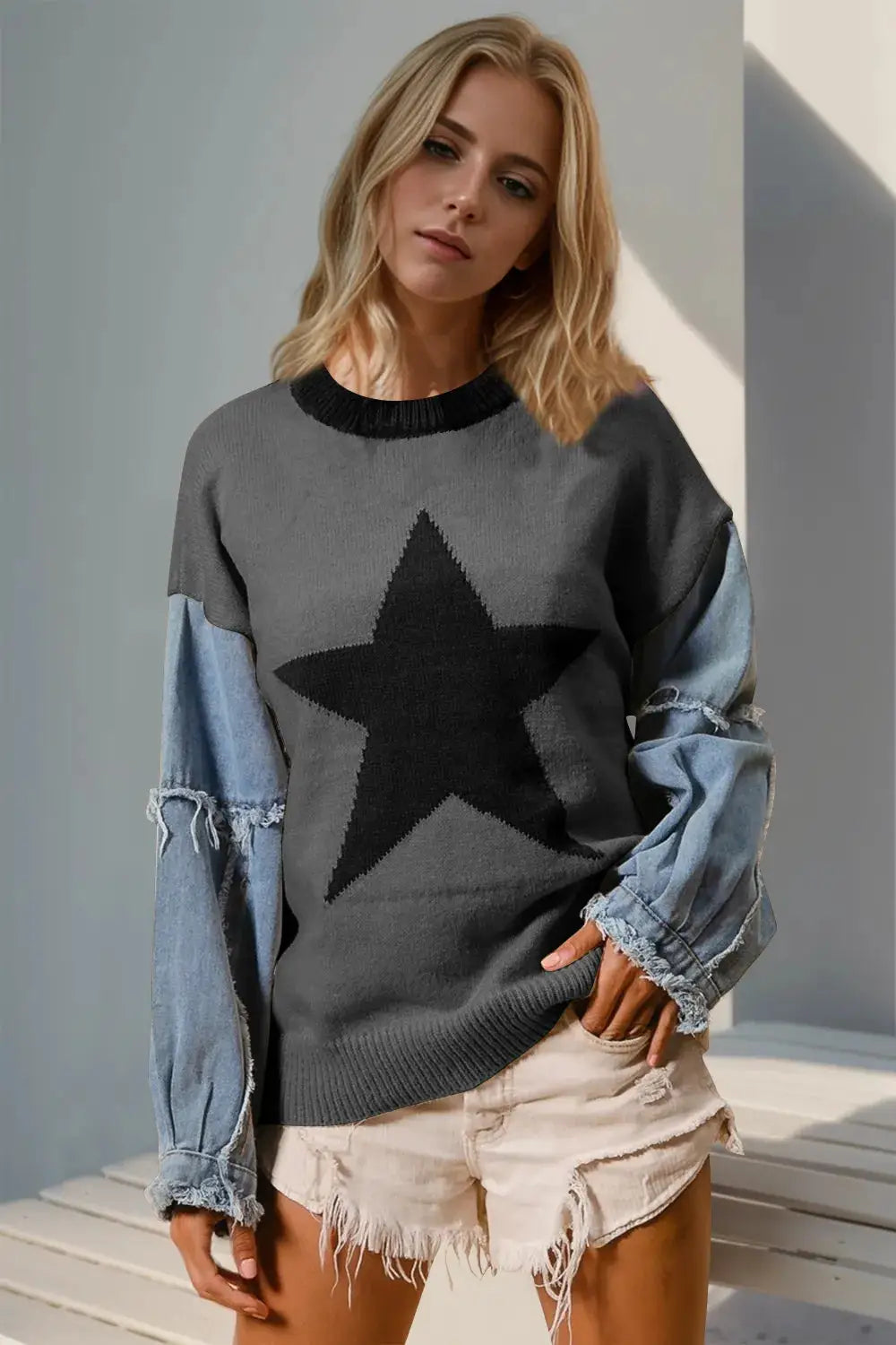Double Take Full Size Star Pattern Raw Edge Long Sleeve Sweater; gray knit with large black star, raw-edge sleeves