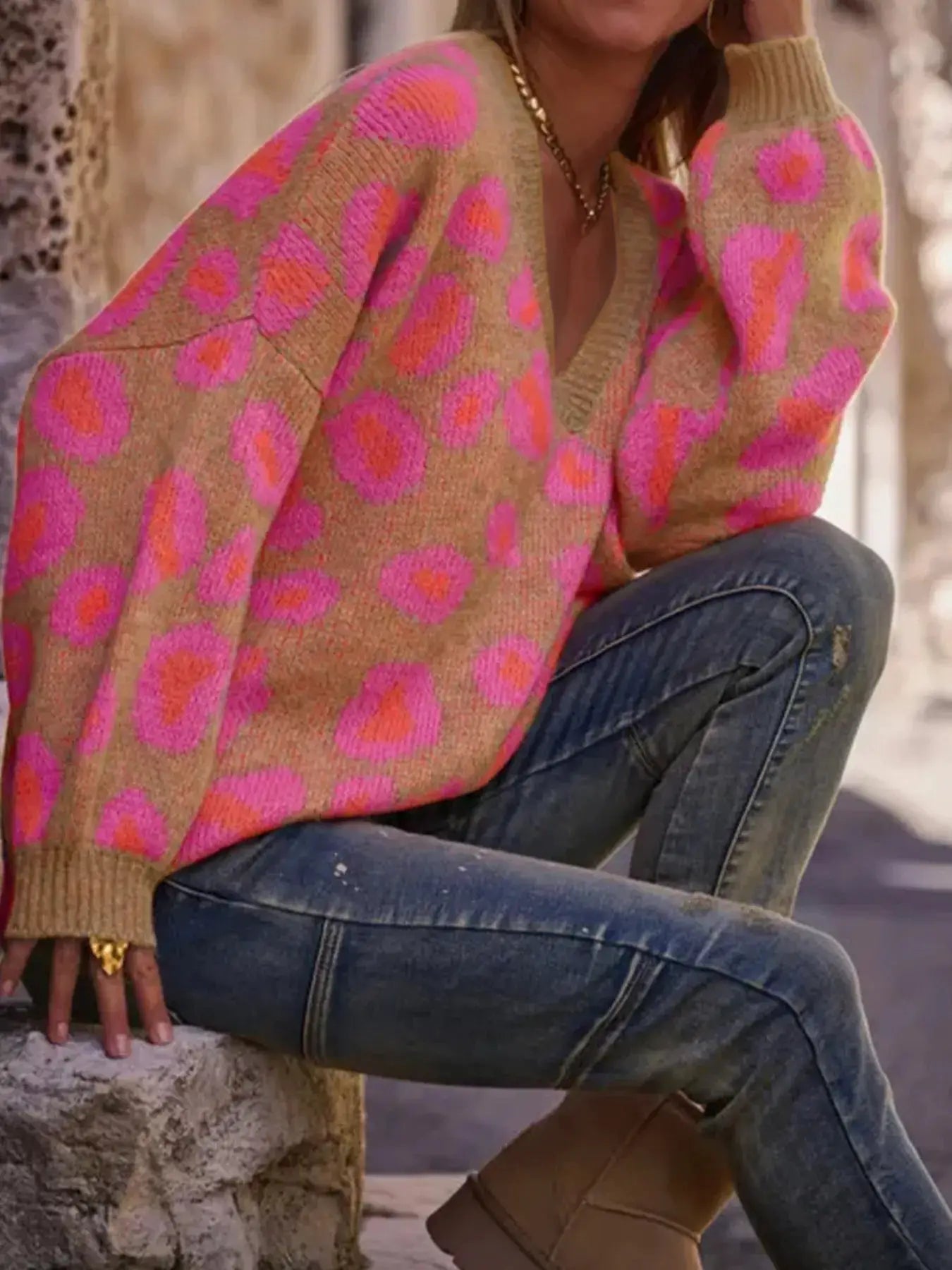 Leopard Oversized V-Neck Sweater in beige knit with pink leopard print.