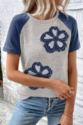Floral Raglan Sleeve T-Shirt in heather gray with navy sleeves and two large embroidered blue flowers on the front