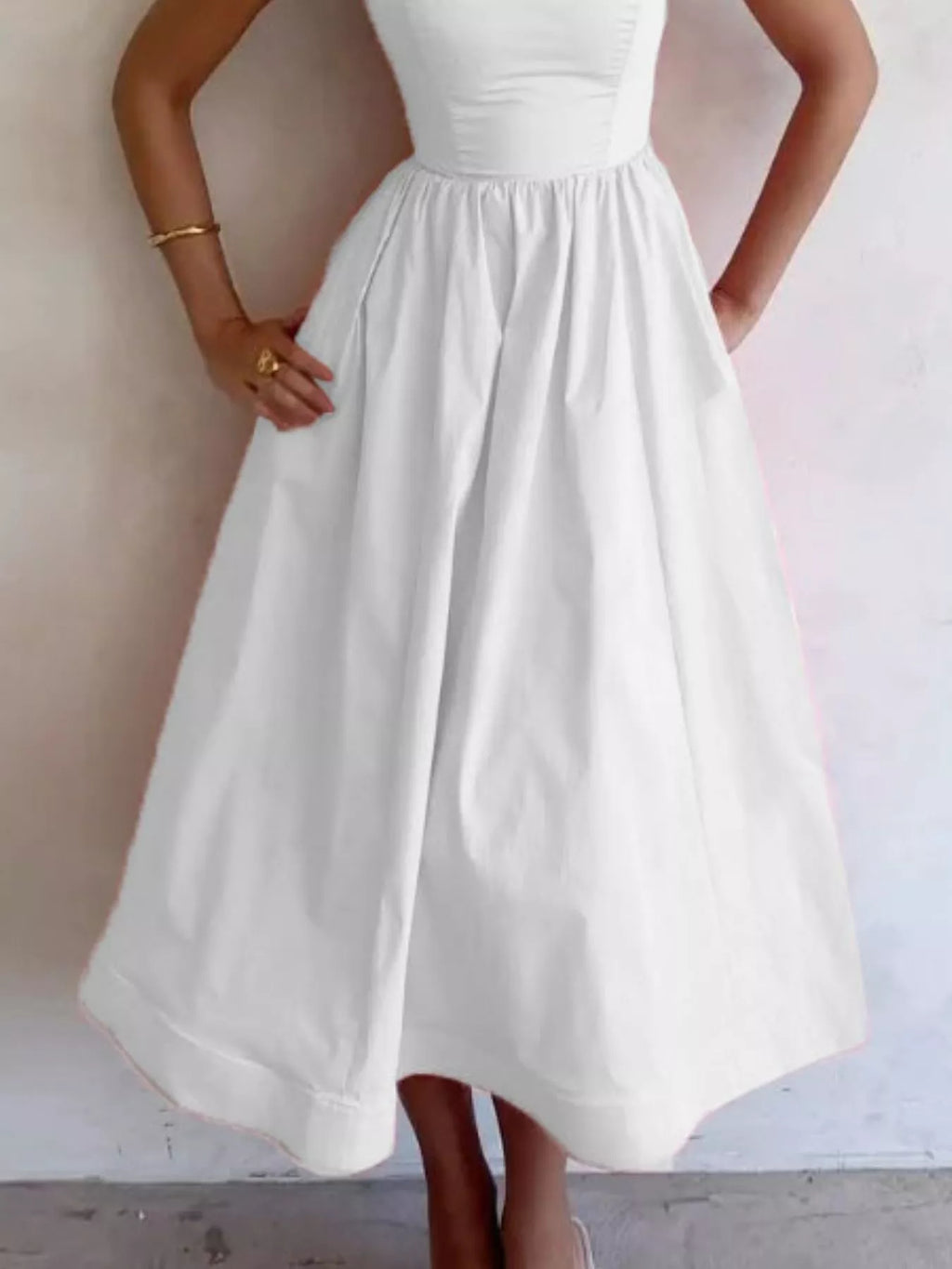 Adjustable-strap scoop-neck white midi dress on a model