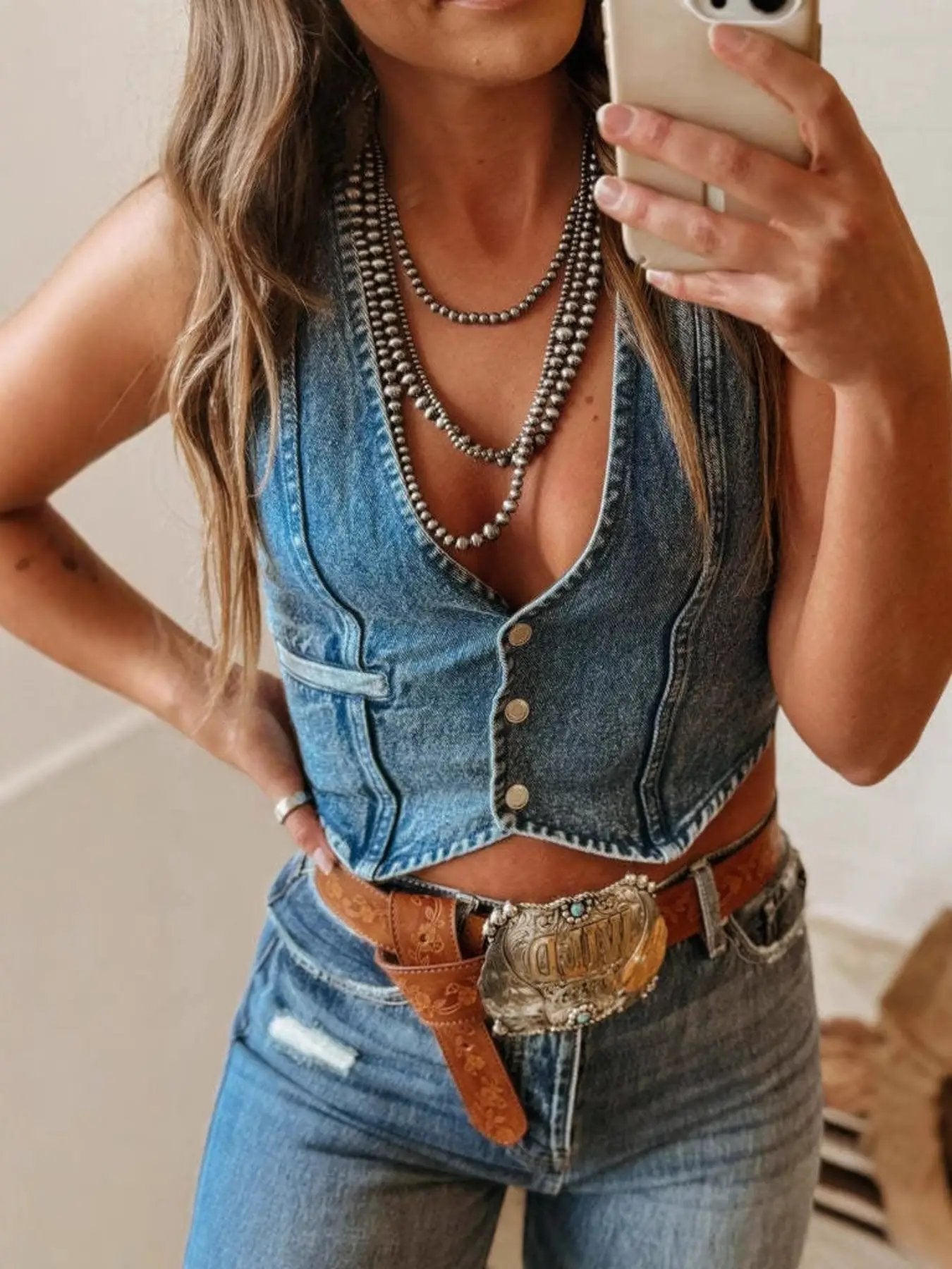 Vintage wash blue denim vest top, cropped sleeveless with button-front and V-neck