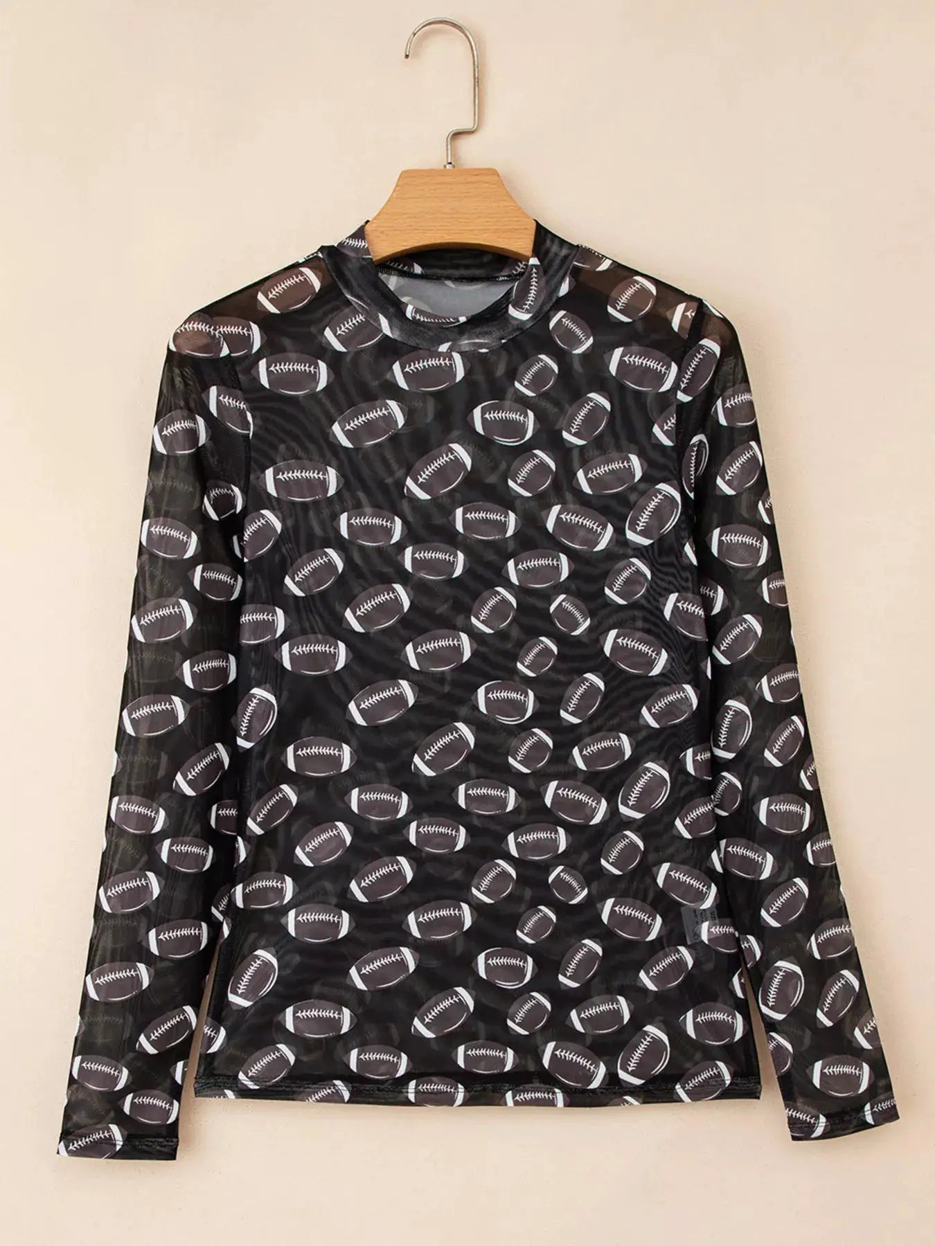 Game Day mesh sheer long sleeve top by Belle Bijouix, black mesh with white football pattern.
