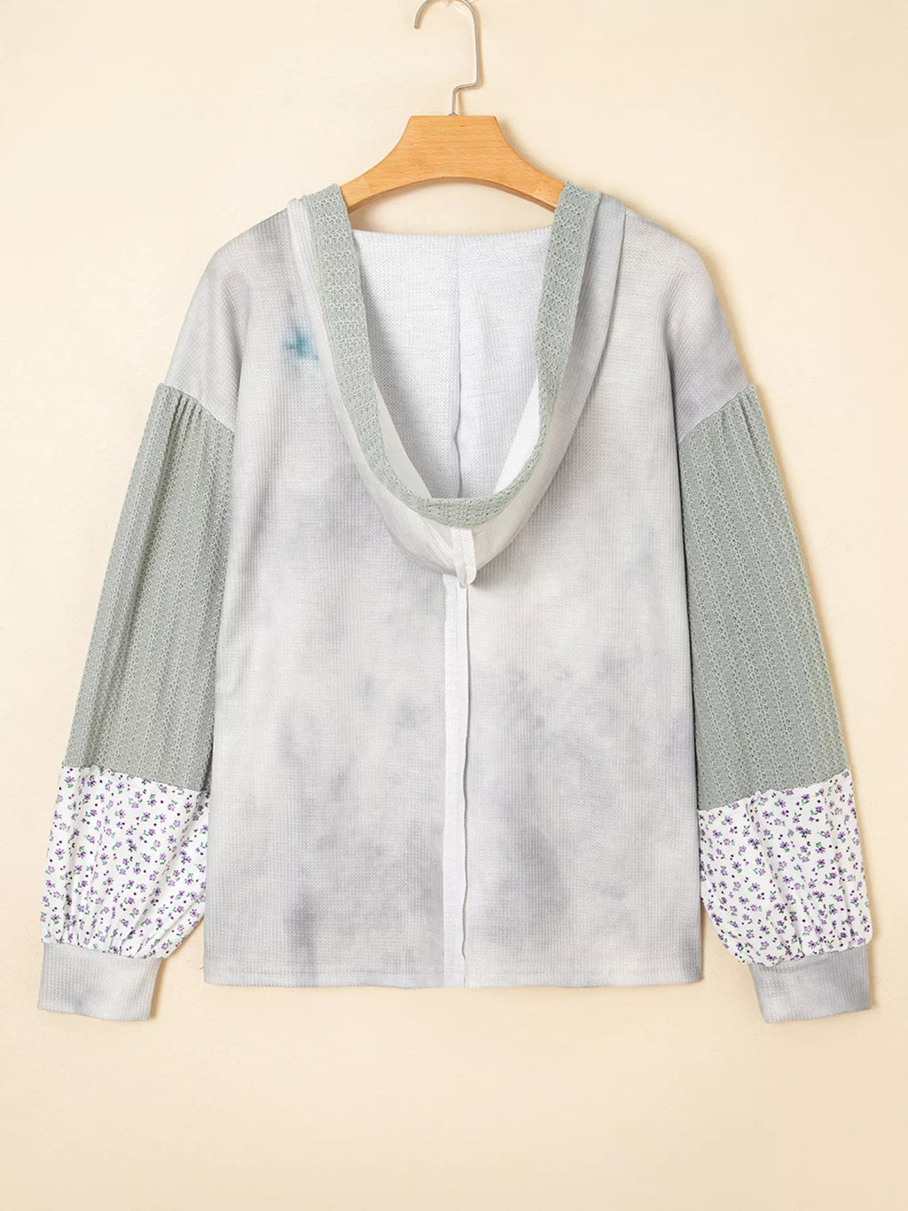 Hooded top with floral-patched sleeves and waffle-textured panels in light gray