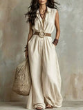 Plus-size sleeveless beige wide-leg jumpsuit with pockets, belted by a round rope belt.