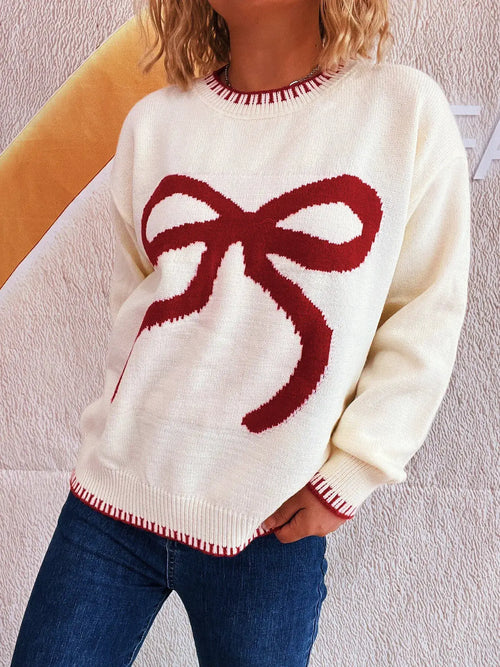 Bow Pattern Round Neck Sweater in white knit with a large red bow graphic; red rib trim at cuffs and hem