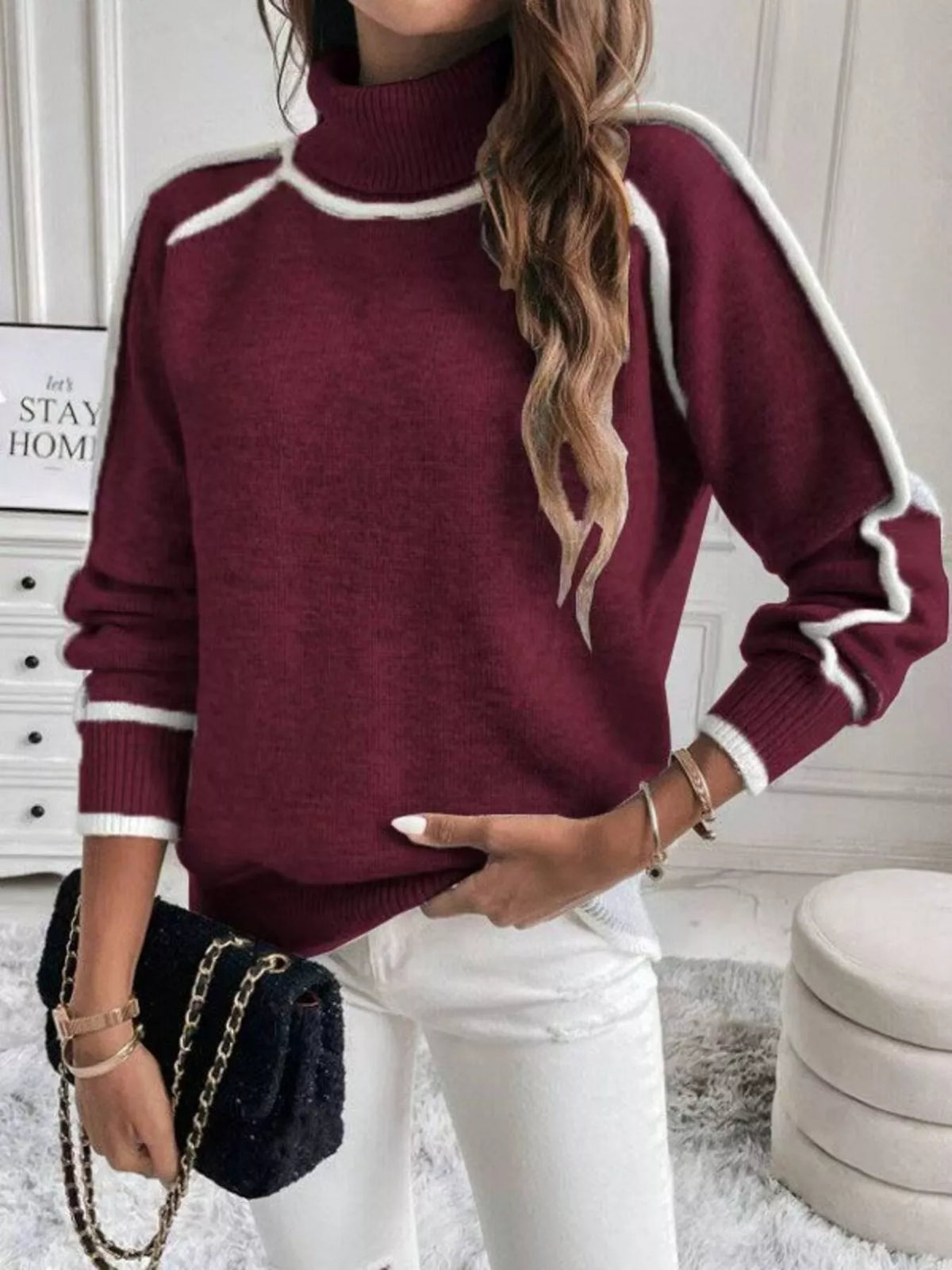 Front view of cherry red turtleneck sweater with white contrast trim