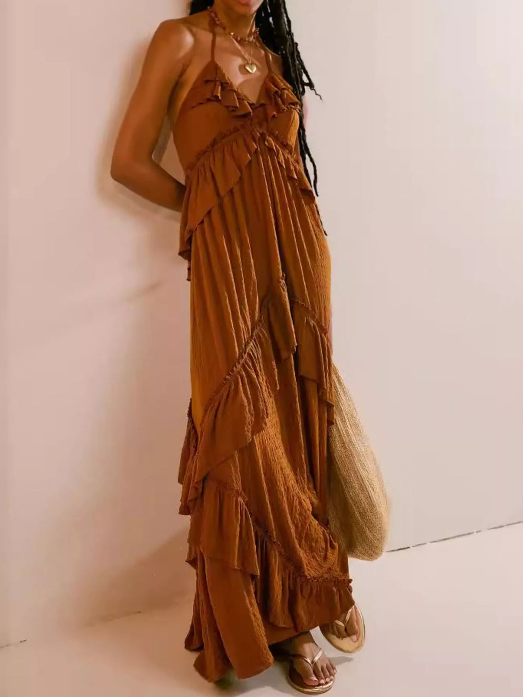 Ruffled halter-neck maxi dress by Belle Bijouix in rust brown with tie and tiered ruffles