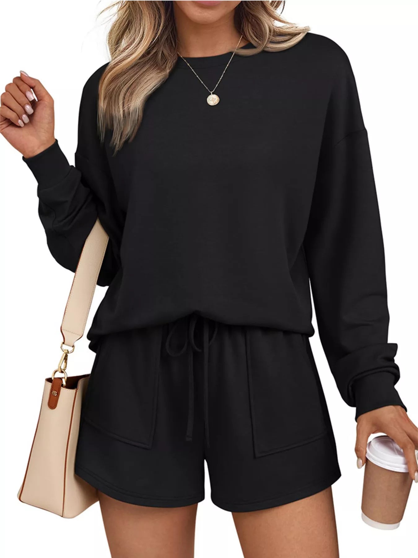 Belle Bijouix two-piece activewear set: black round-neck long-sleeve top with matching drawstring pocket shorts