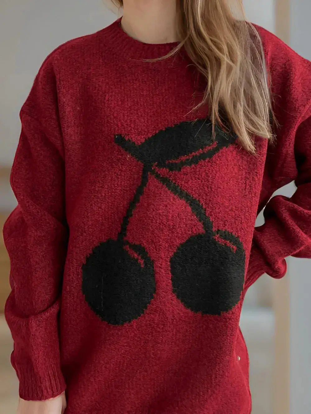 Cherry Round Neck Long Sleeve Sweater in red knit with a black cherry graphic.