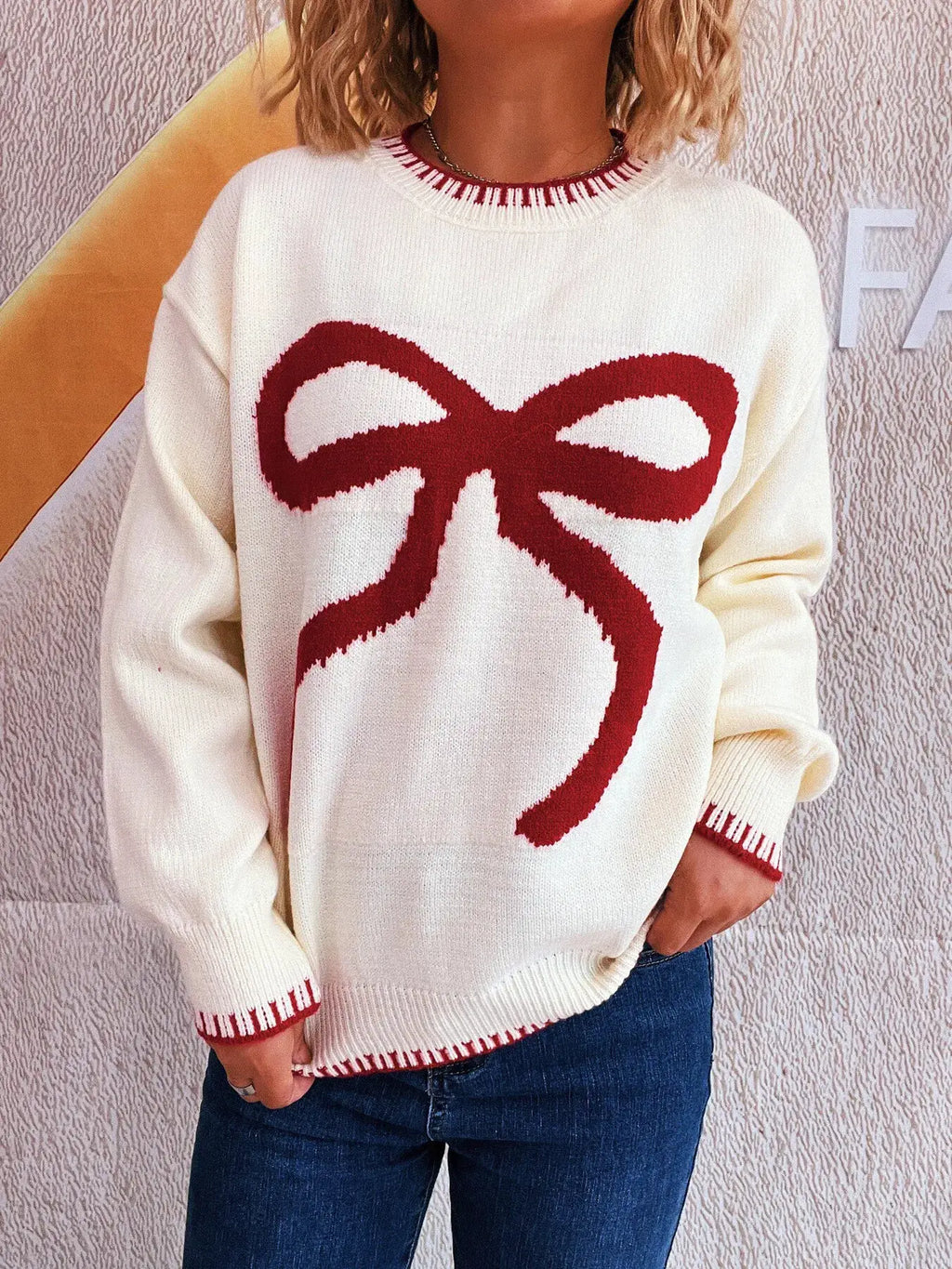 Bow Pattern Round Neck Sweater by Belle Bijouix, white knit with red bow and red rib trim