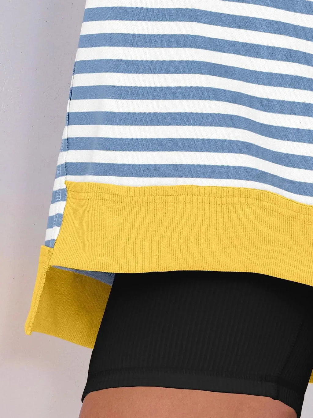 Notched Long Sleeve Oversized Sweatshirt in blue-and-white stripes with a yellow ribbed hem.
