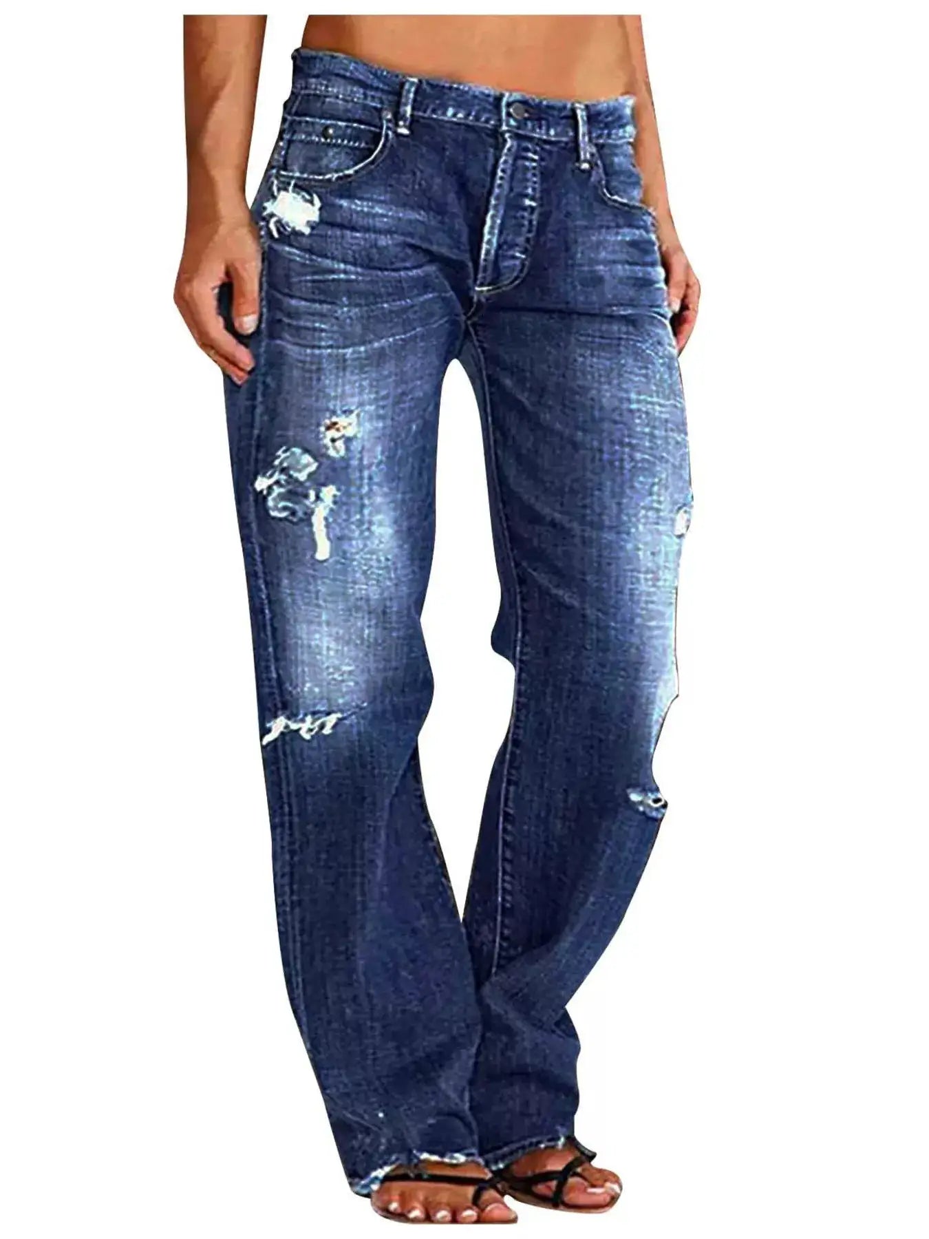 Distressed loose-fit jeans in blue denim with ripped knees and faded whiskering.