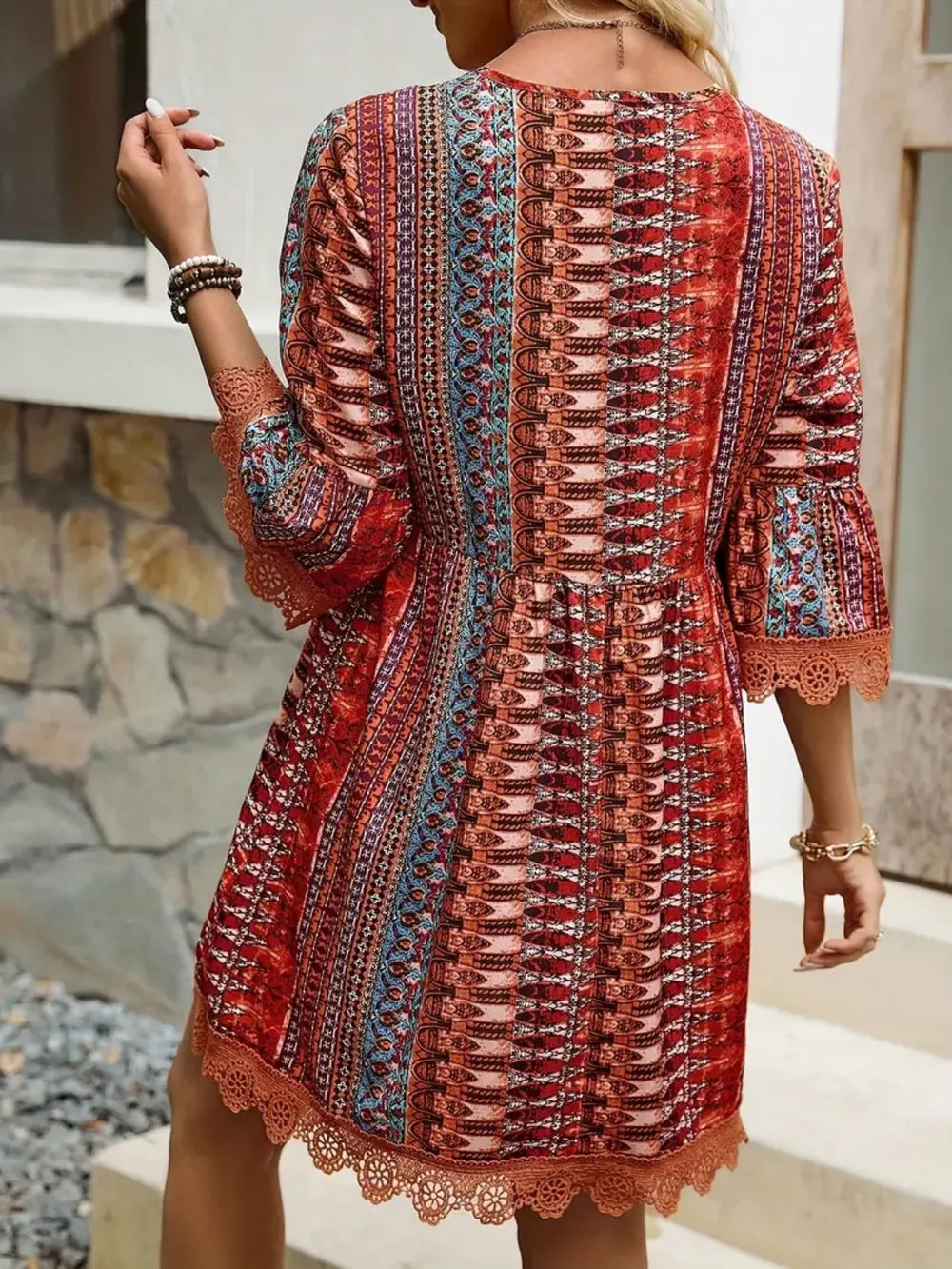 Dress with printed lace trim back view; boho red and blue pattern, 3/4 sleeves, scalloped hem.