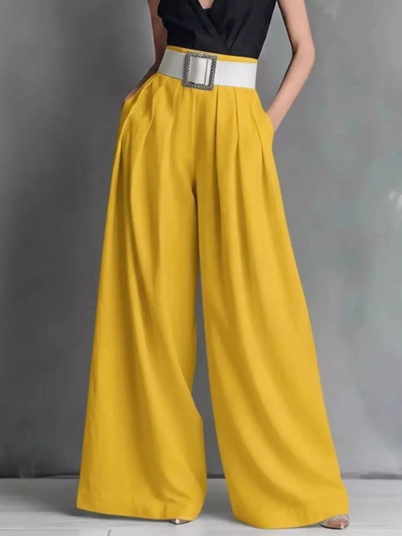 High-Waisted Wide-Leg Pants in mustard yellow with a white belt and square buckle.