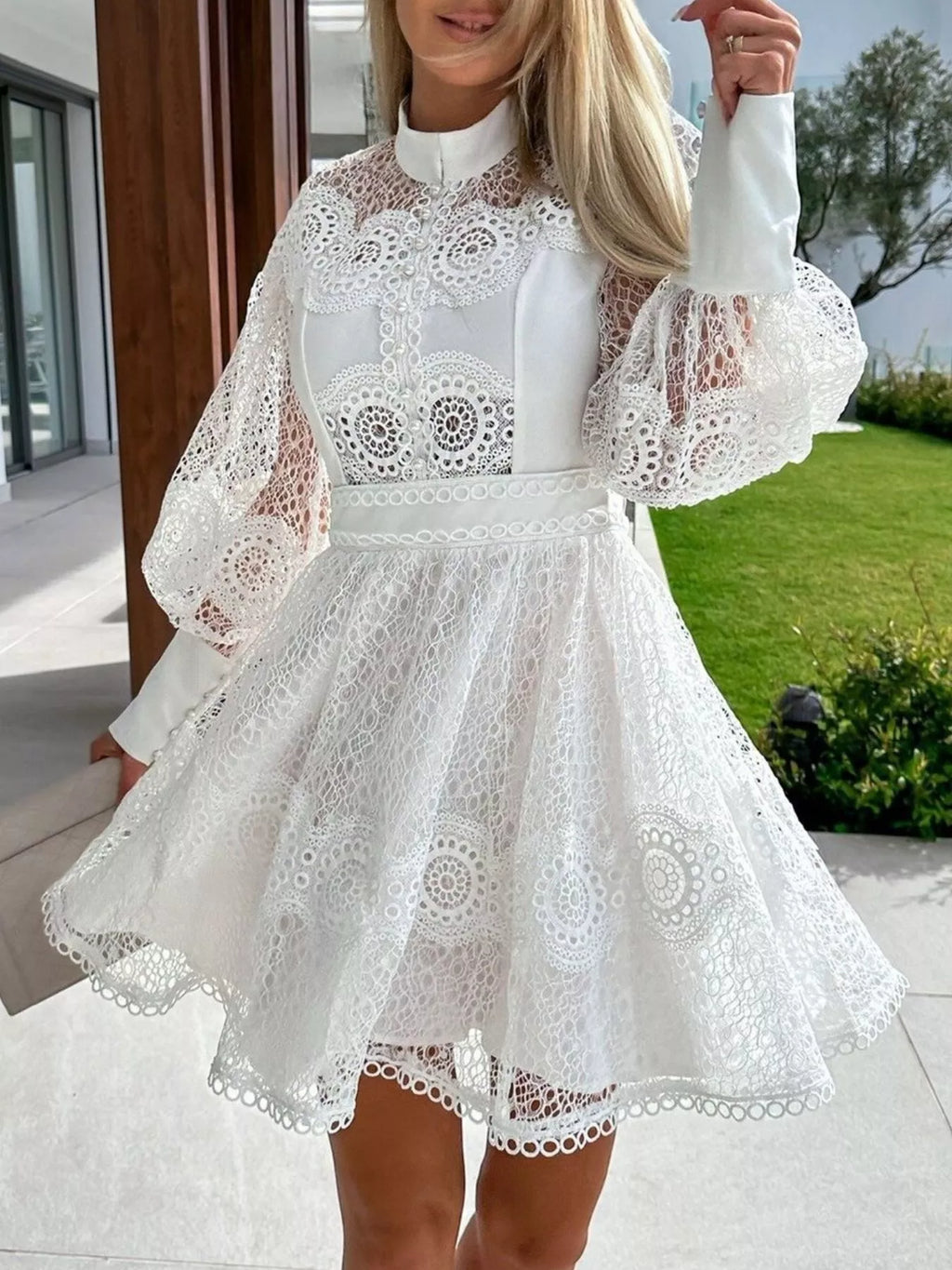 Lace Lantern Sleeve Mini Dress in white with a buttoned bodice and flared lace skirt