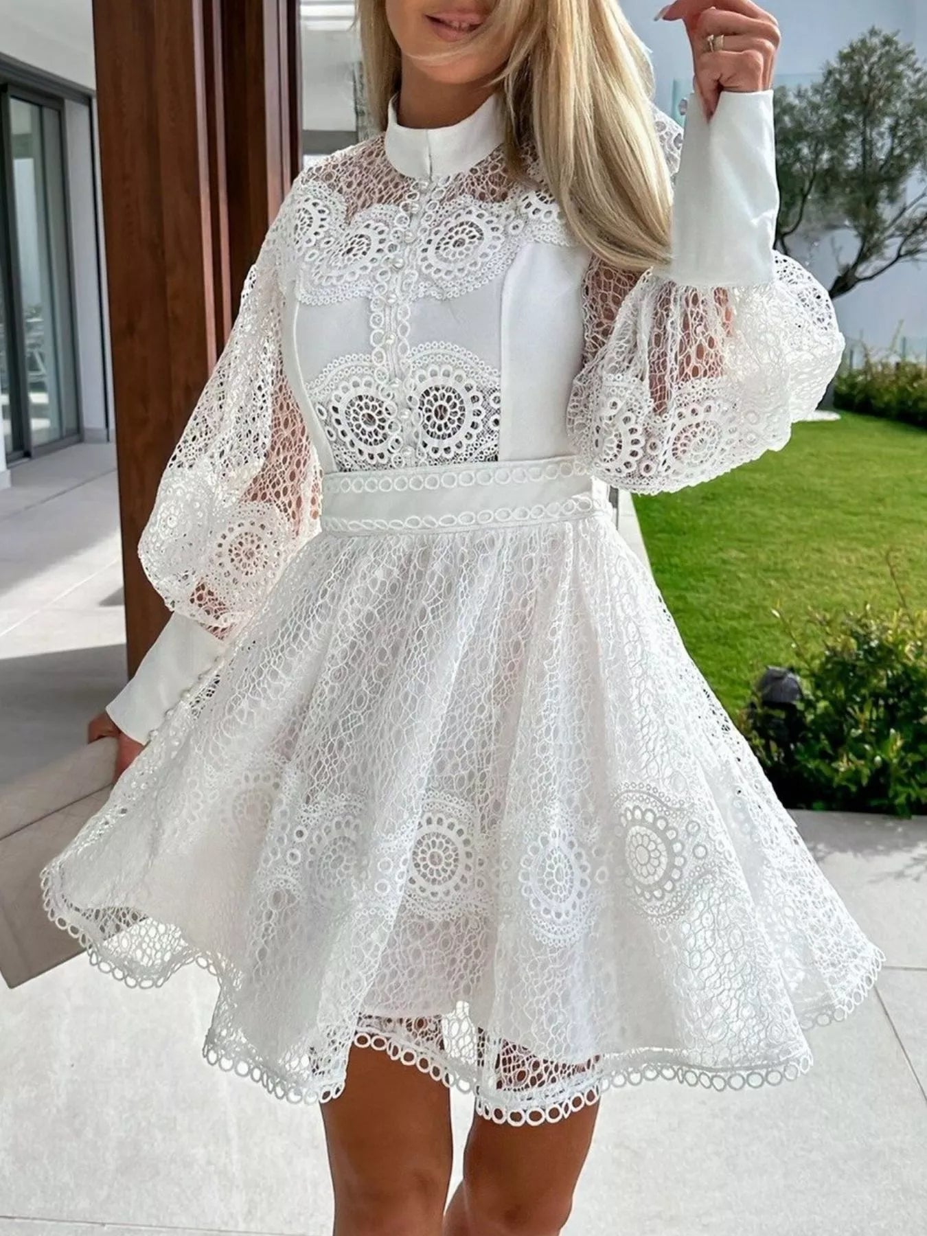 Lace Lantern Sleeve Mini Dress in white with a buttoned bodice and flared lace skirt