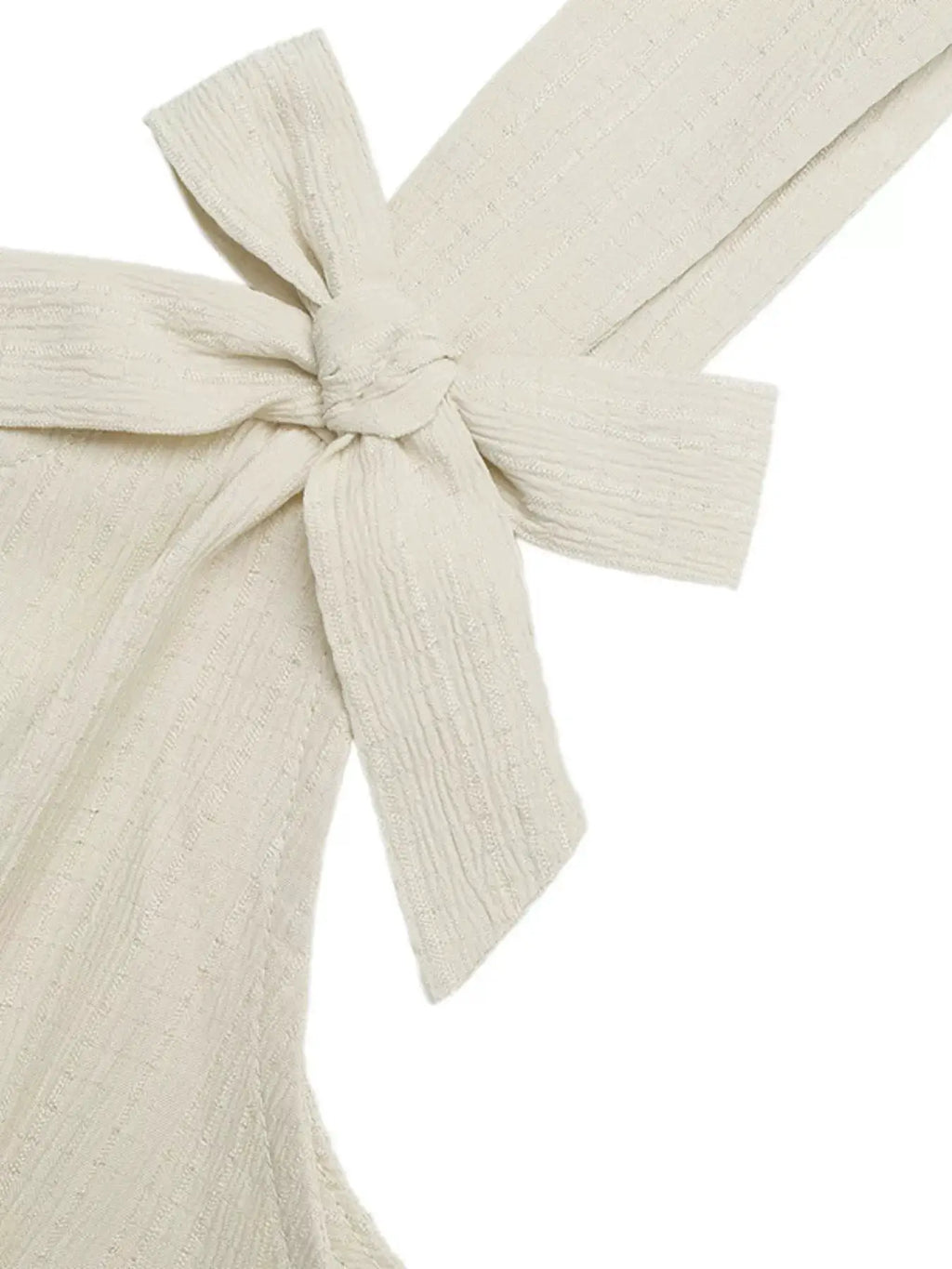 Bowknot Strap Pleated Detail Romper in cream; tied bow on textured fabric