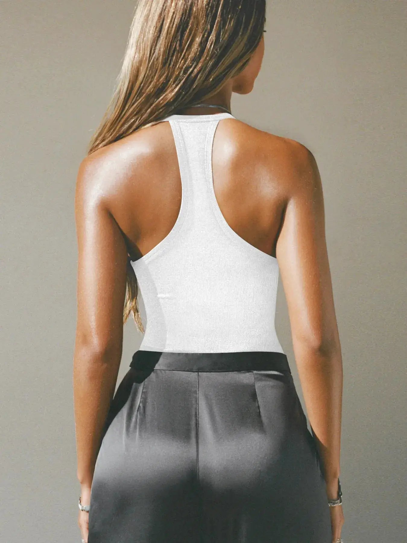 Cutout ribbed tank top in white with a racerback silhouette.
