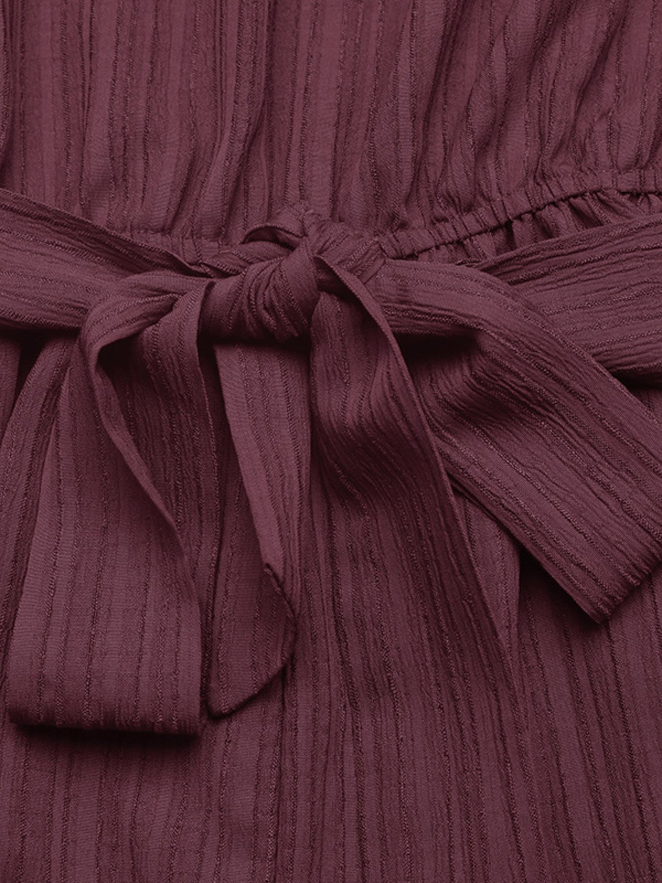 One-Shoulder Tie-Waist Romper in burgundy ribbed fabric