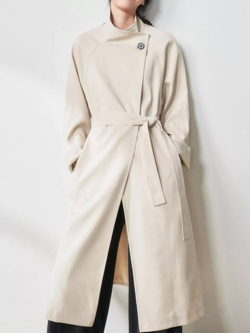 Asymmetric Button Belted Longline Trench Coat in Beige by Belle Bijouix – view 1 of 15
