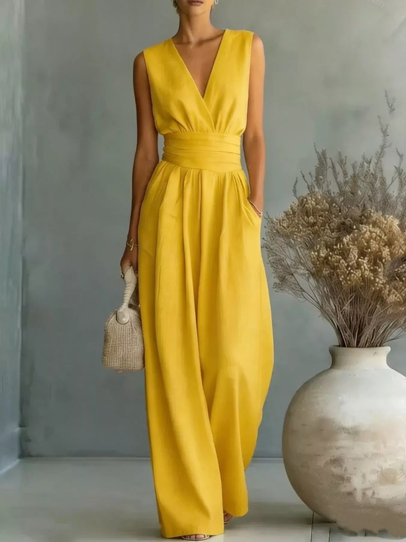 Full Size Sleeveless Wide Leg Jumpsuit in yellow with a V-neck wrap top and ruched waist.
