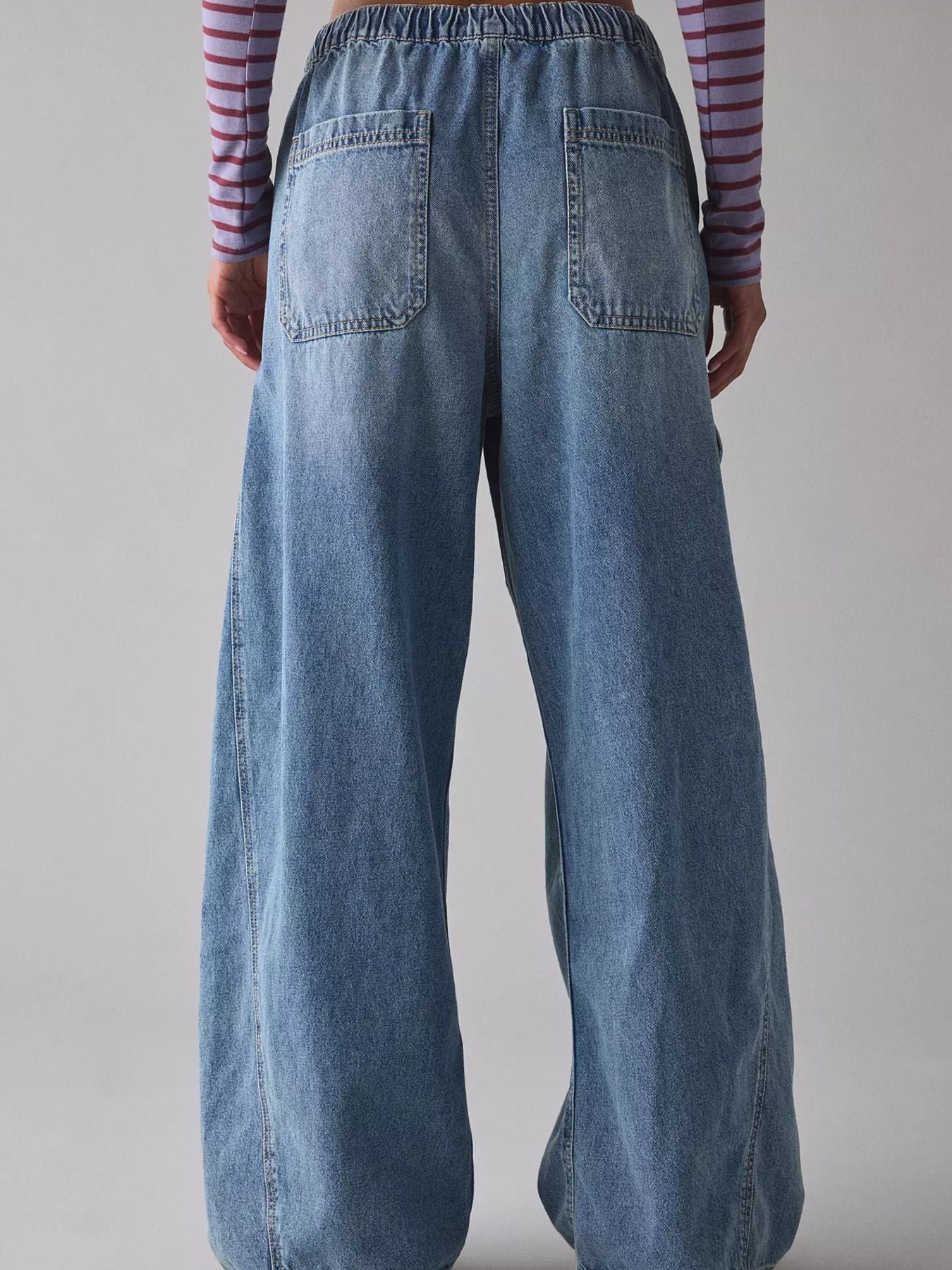 Drawstring Waist Cargo Jeans by Trendsi in light denim, back view with elastic waist and large patch pockets