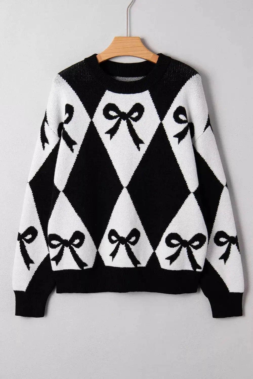 Bow Pattern Long Sleeve Contrast Sweater by Belle Bijouix, black and white bow-argyle knit
