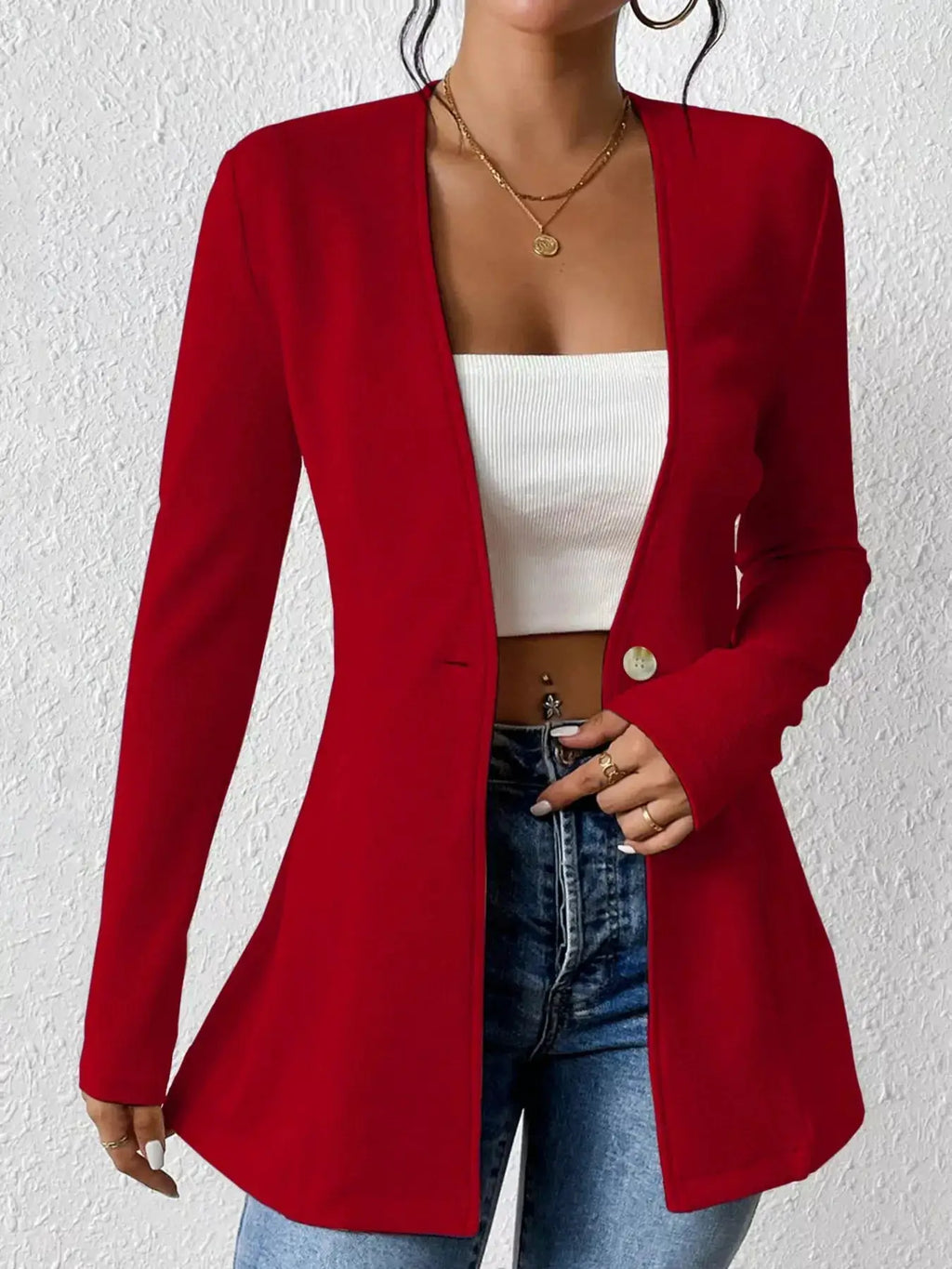 Belle Bijouix red single-button blazer, long sleeves, open-front worn over a white ribbed crop top and jeans.