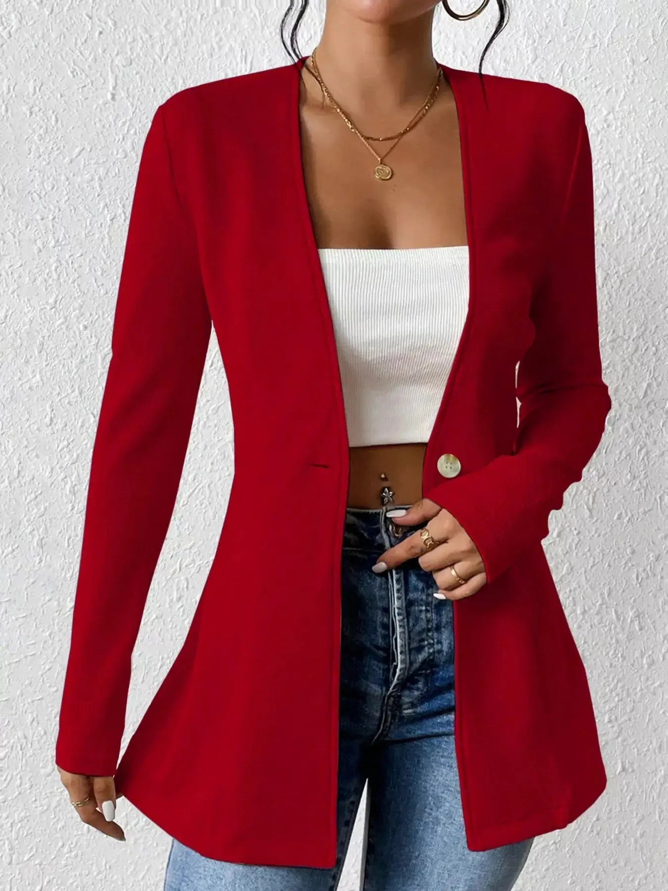 Belle Bijouix red single-button blazer, long sleeves, open-front worn over a white ribbed crop top and jeans.