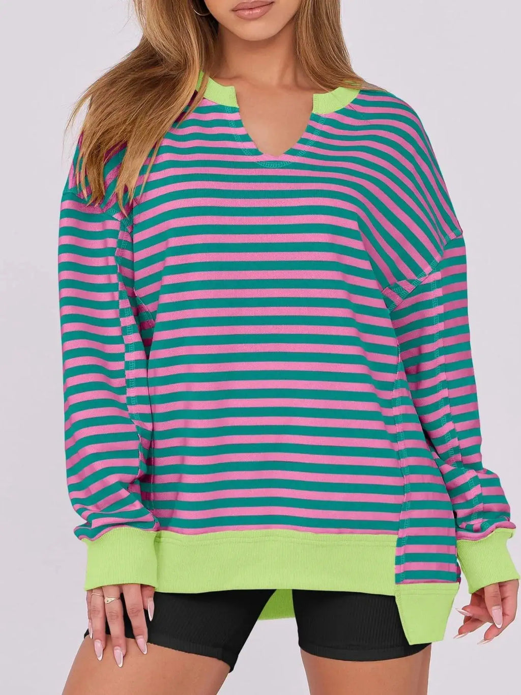 Notched long sleeve oversized sweatshirt in pink and teal stripes with neon lime cuffs and hem by Belle Bijouix