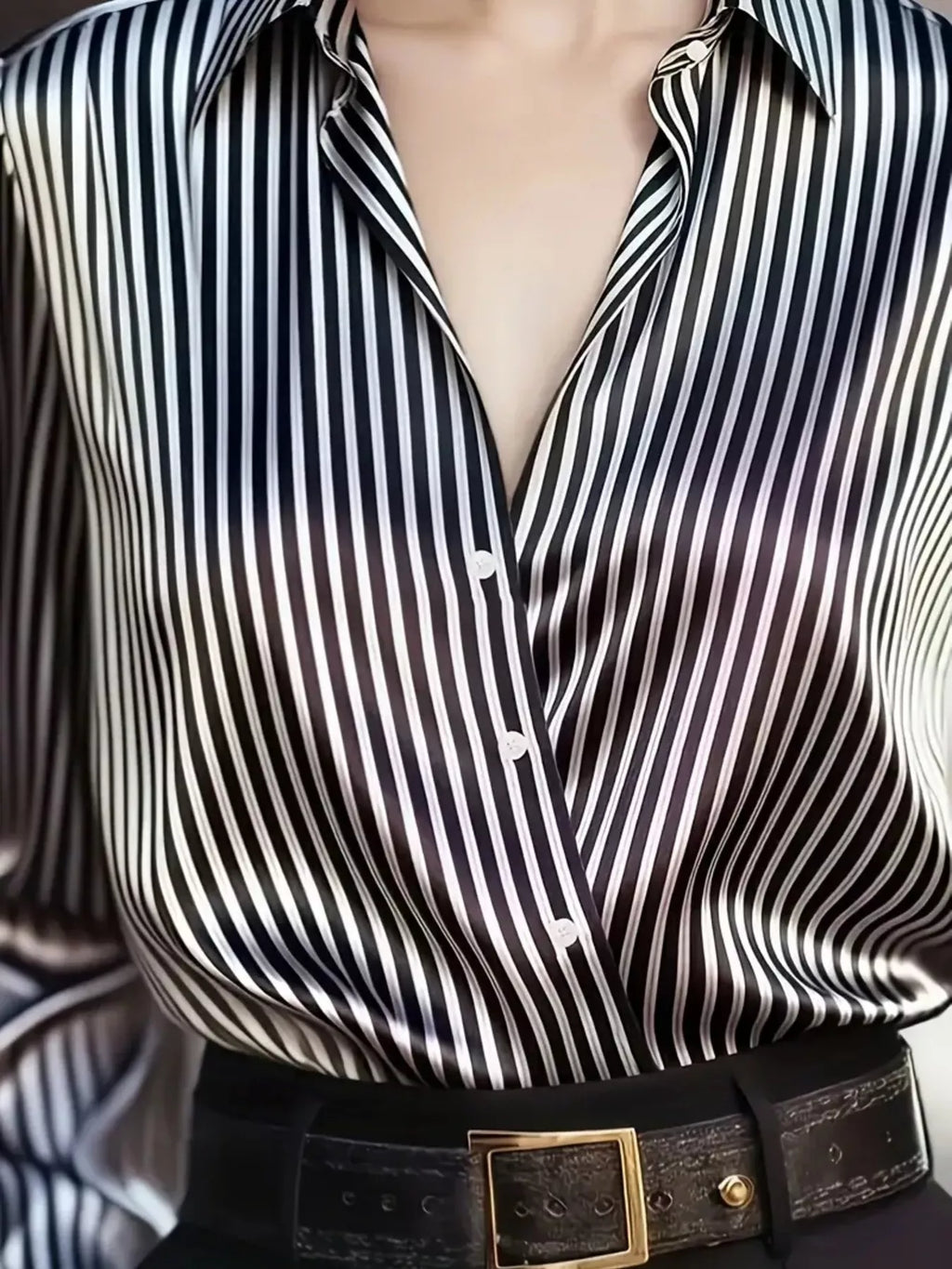 Striped long-sleeve shirt by Belle Bijouix, black and white vertical stripes, button-down front