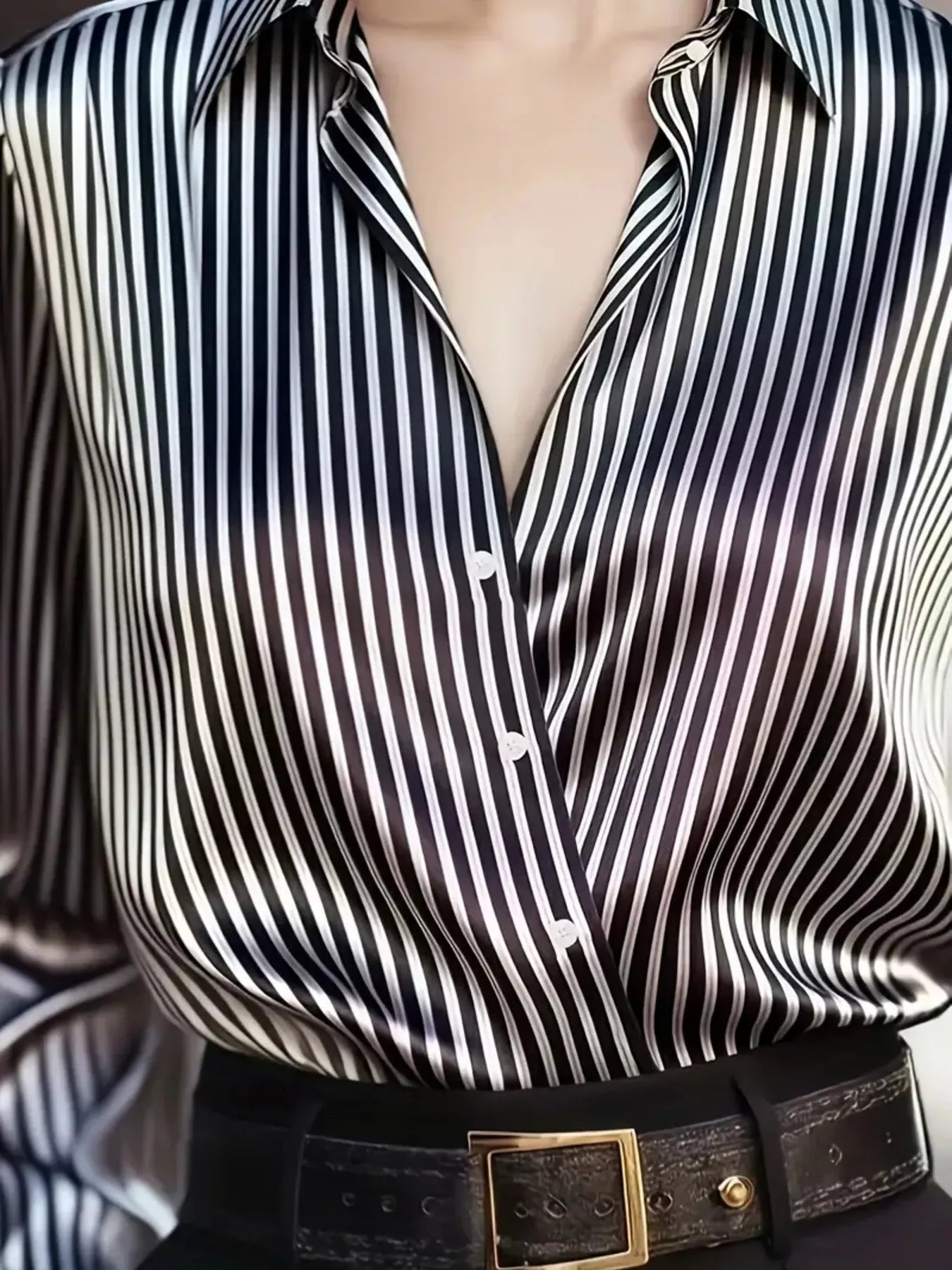 Striped long-sleeve shirt by Belle Bijouix, black and white vertical stripes, button-down front