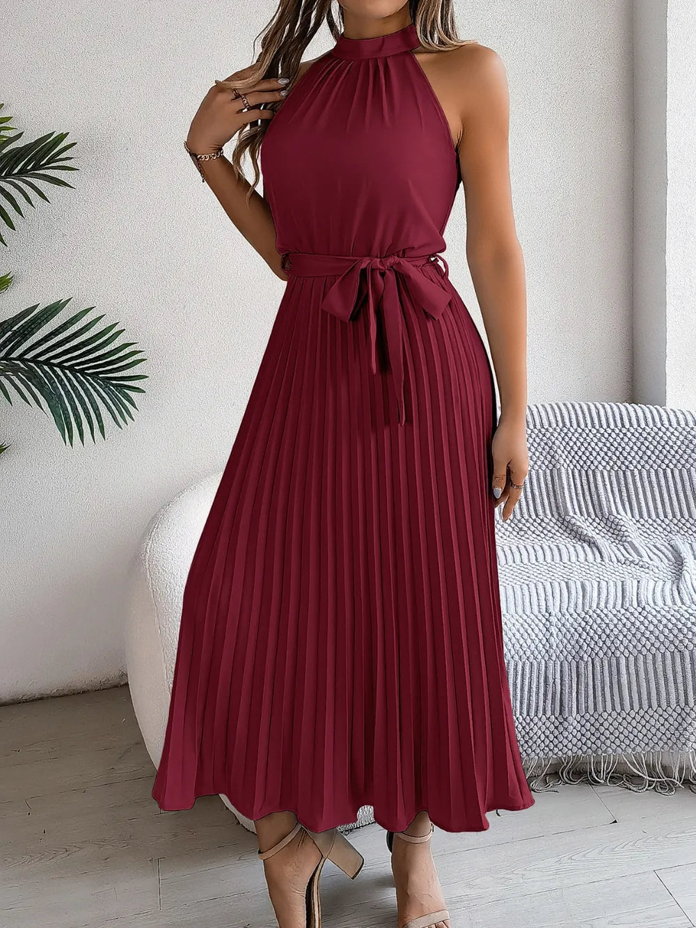 Pleated tie-waist sleeveless midi dress in burgundy.