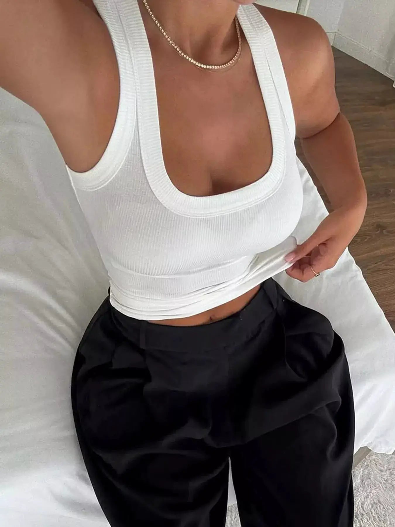 Ribbed solid color tank top in white, sleeveless with scoop neckline