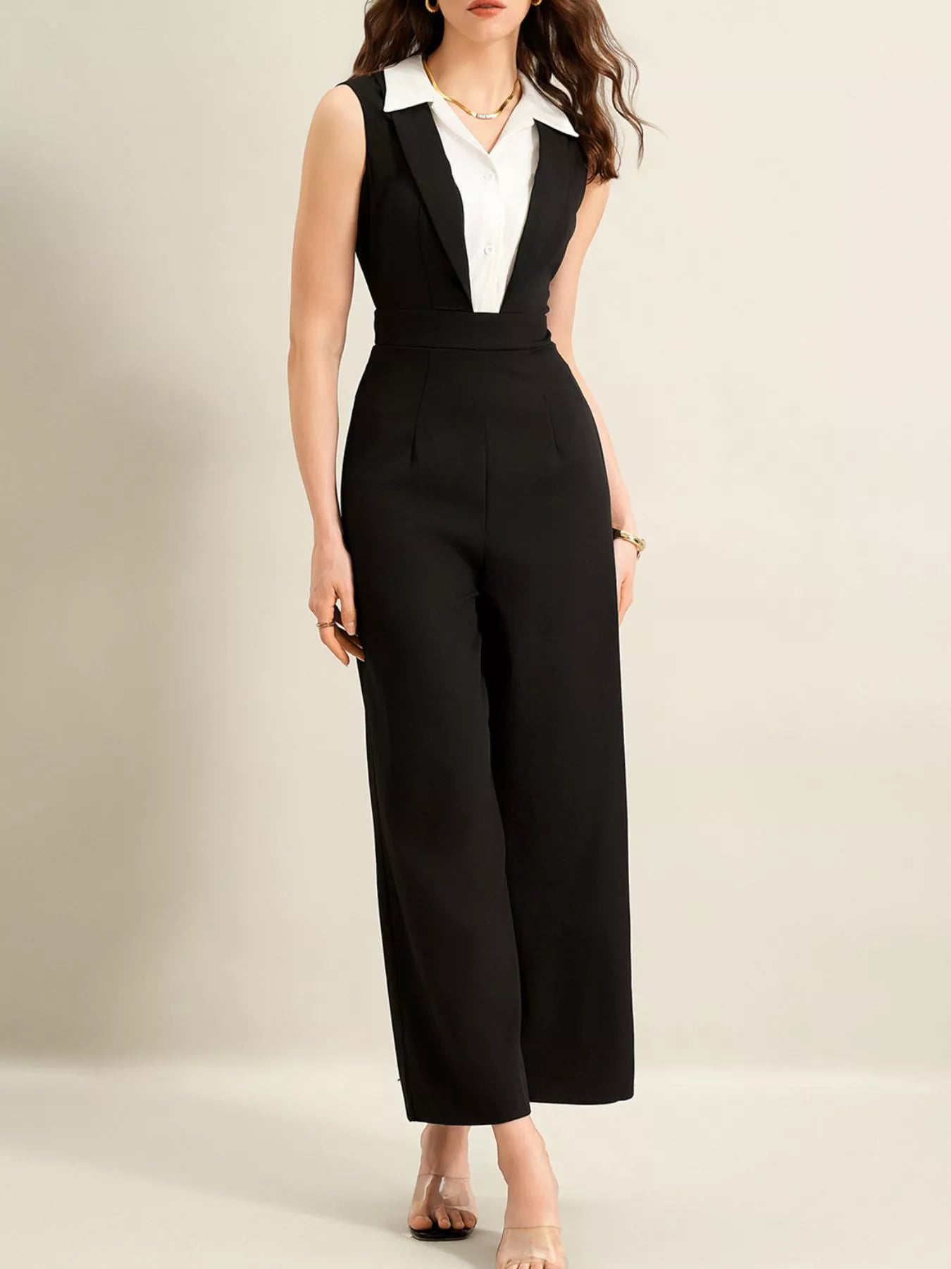Sleeveless black wide-leg jumpsuit with a tailored bodice and front zipper closure.