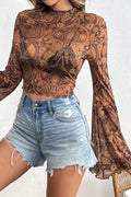 Printed mock-neck flare-sleeve top in brown paisley sheer fabric; cropped length