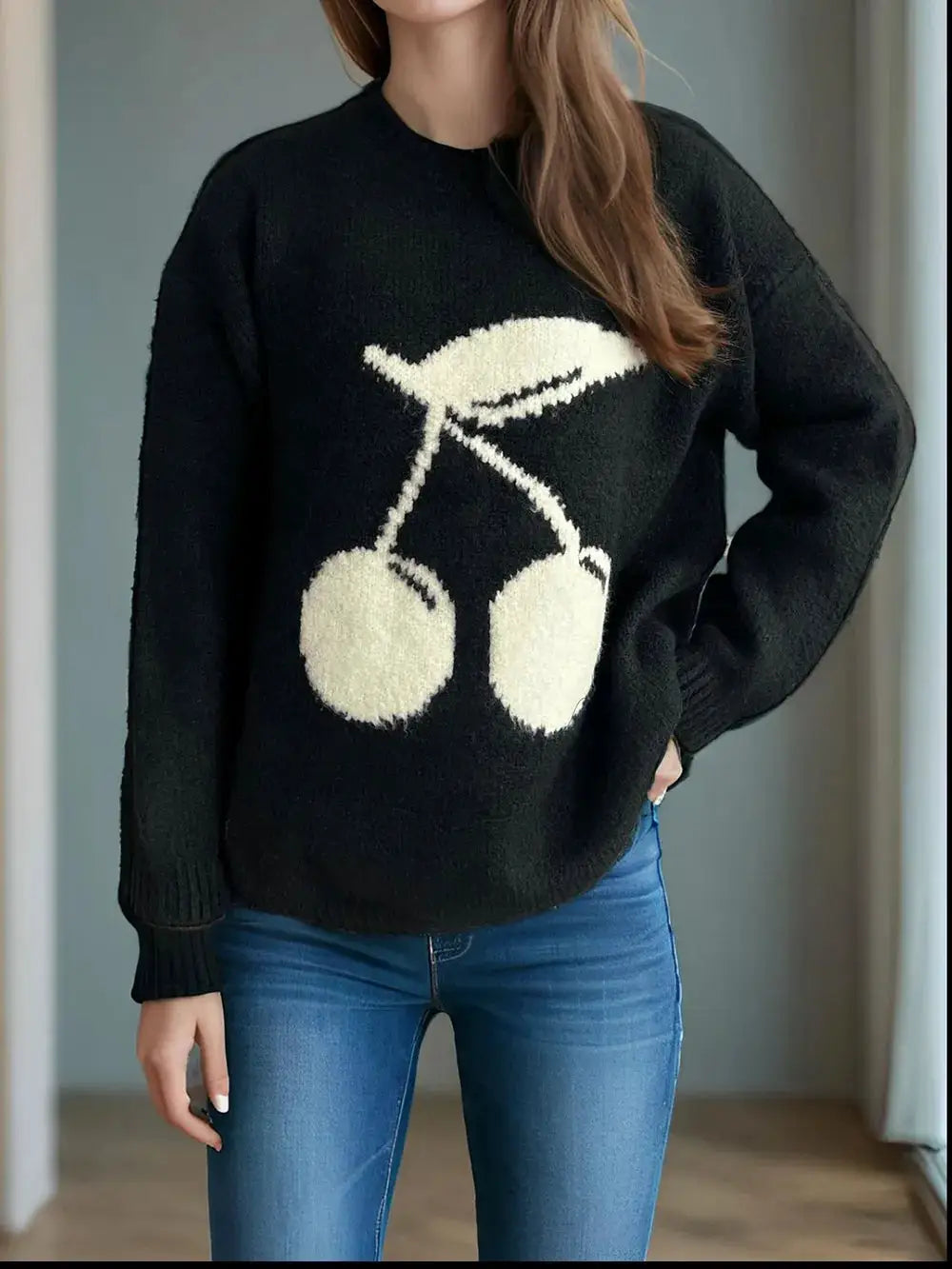 Cherry round-neck long-sleeve sweater by Belle Bijouix, black knit with white cherry graphic on front.