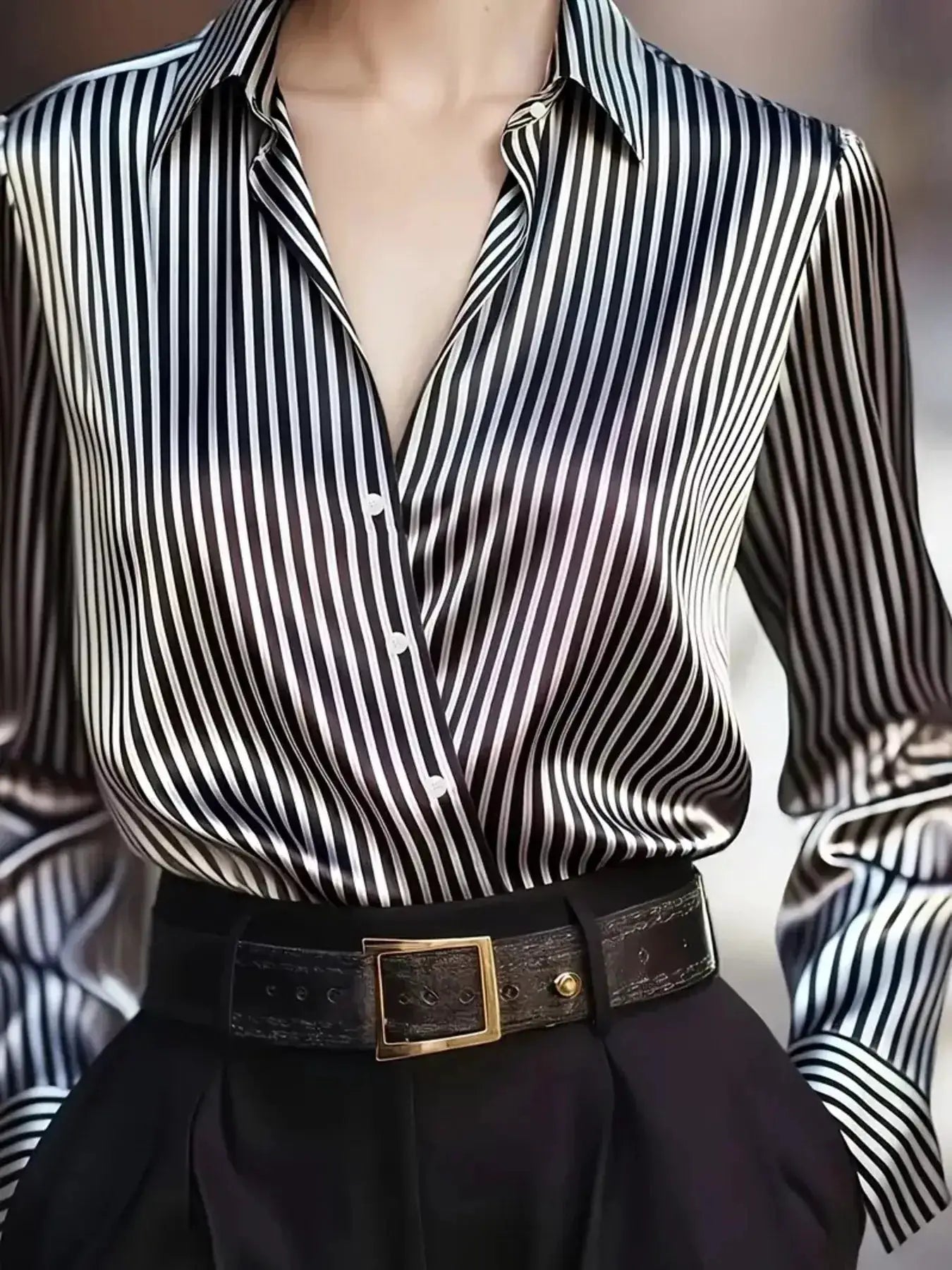 Belle Bijouix striped long-sleeve shirt in black and white with button-front.