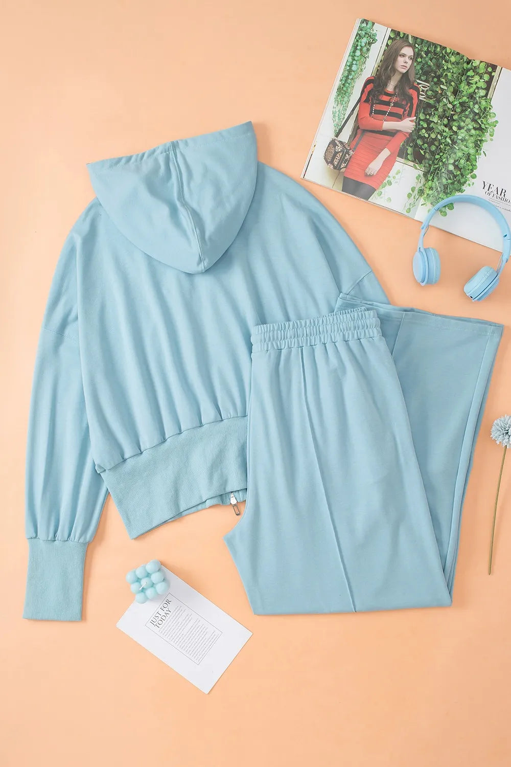 Bellebijouix Zip-Up Hoodie and Pants Active Set in light blue; hoodie with drawstring and zipper, matching pants.