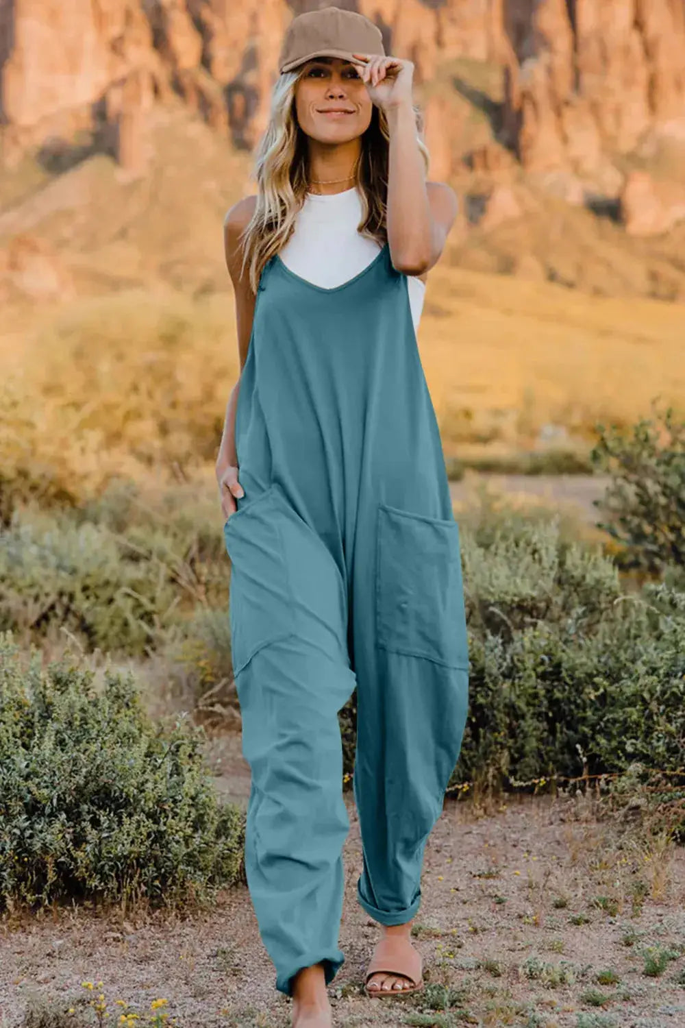 Belle Bijouix Double Take full-size V-neck sleeveless jumpsuit with pockets in teal.