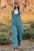Belle Bijouix Double Take full-size V-neck sleeveless jumpsuit with pockets in teal.