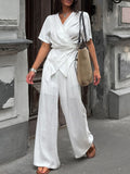 Belle Bijouix Wrap Top & Wide-Leg Pants Set in white with tied waist