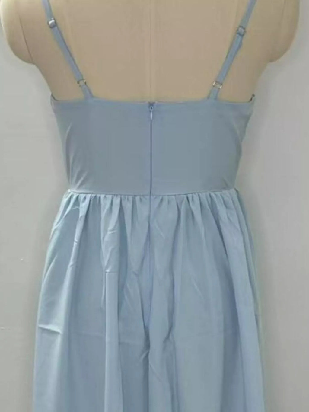 Adjustable-strap scoop-neck midi dress in light blue with back zipper and gathered skirt.