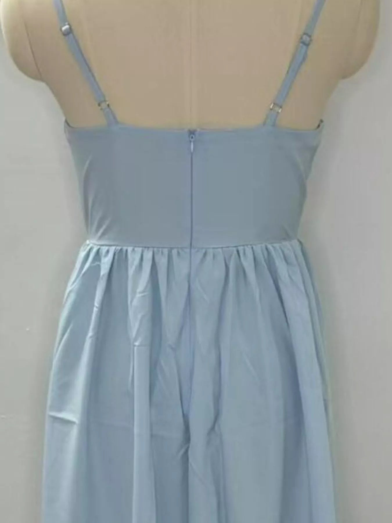 Adjustable-strap scoop-neck midi dress in light blue with back zipper and gathered skirt.