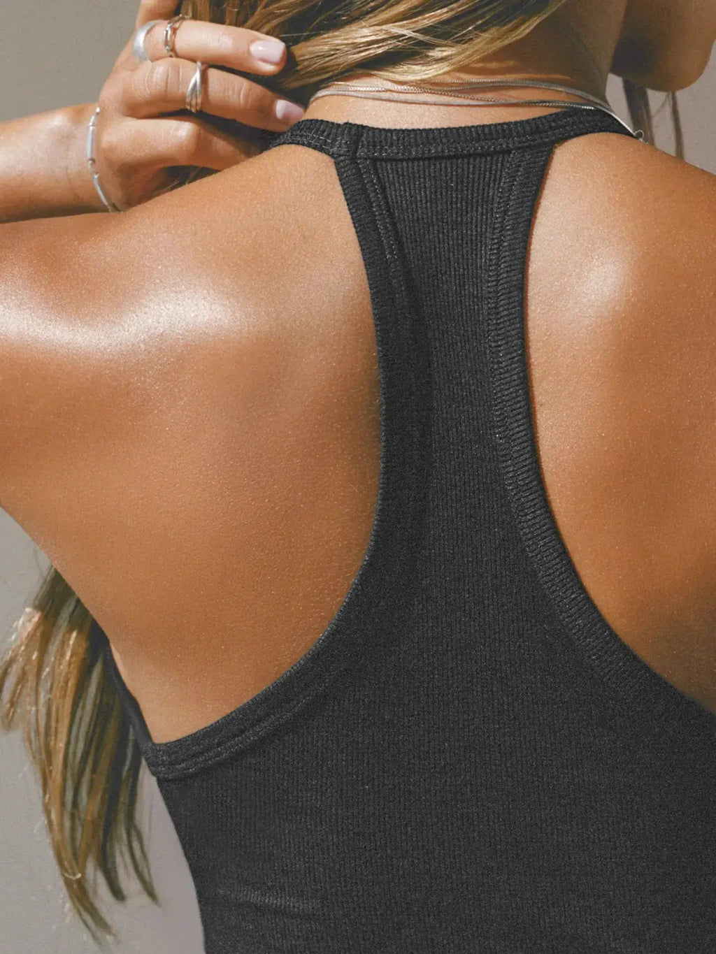 Cutout ribbed tank top in black with racerback design