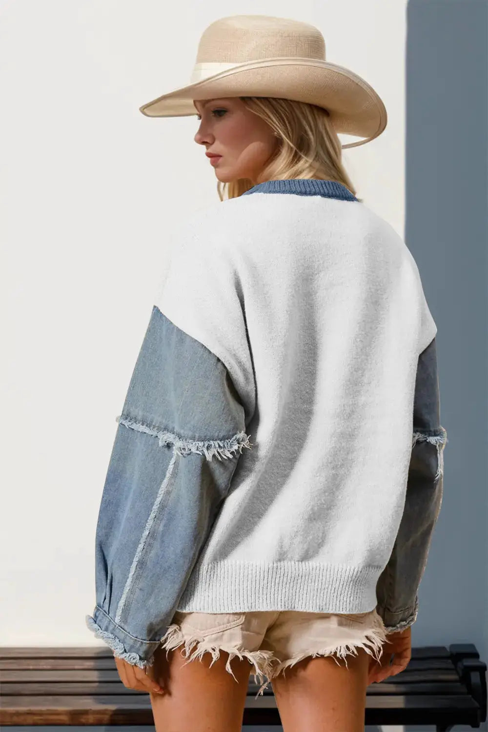 Double Take sweater by Belle Bijouix, white knit bodice with blue denim sleeves and frayed edges