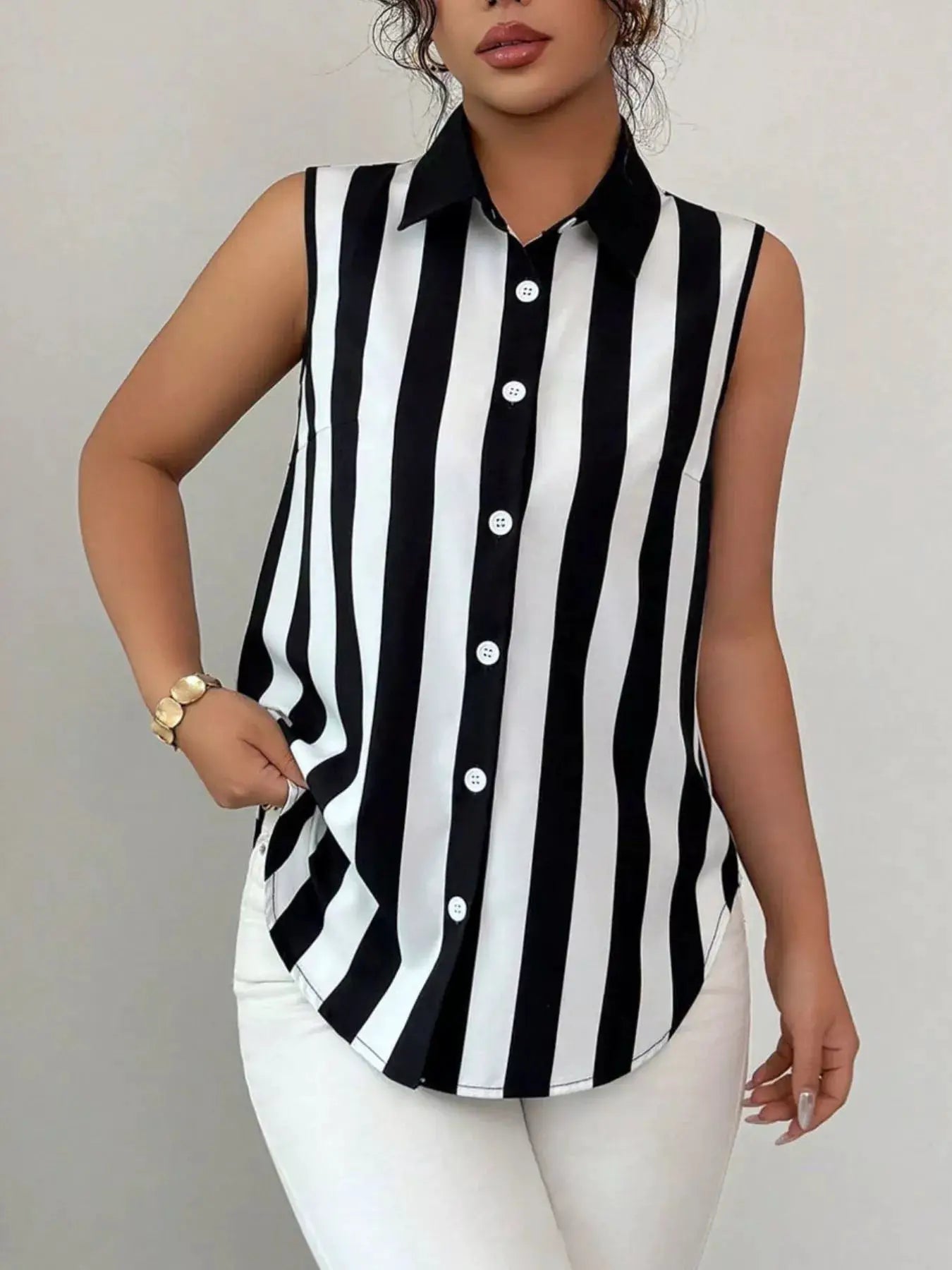 Button-up sleeveless striped shirt in black and white with a collar and white buttons.
