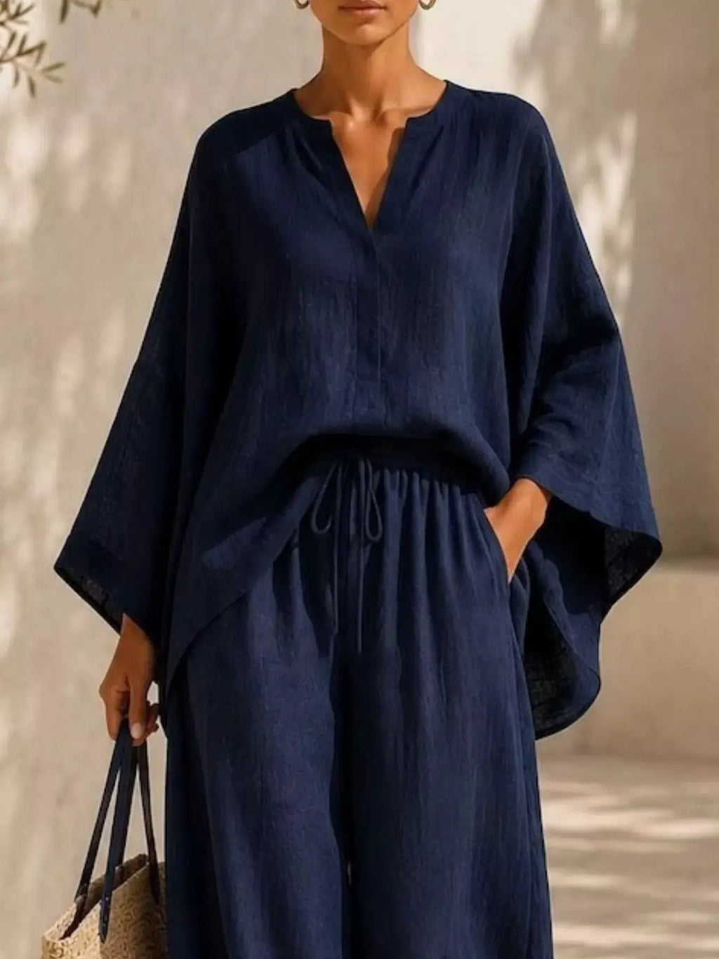 Plus Size Notched Long Sleeve Top & Wide Leg Pants Set in navy with drawstring waist and relaxed fit.